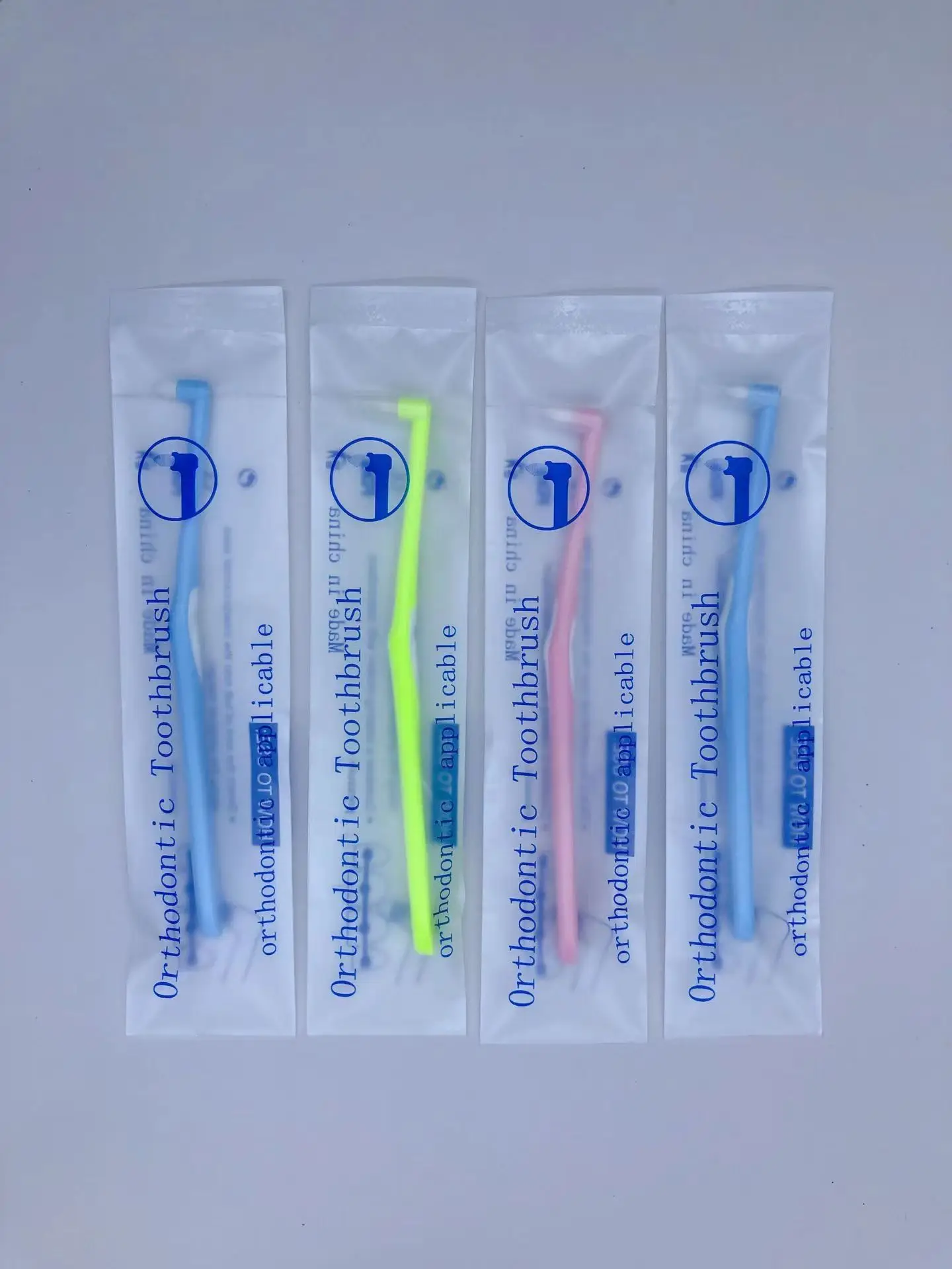 Hot selling custom logo L-shaped orthodontic toothbrush with single bundle brush