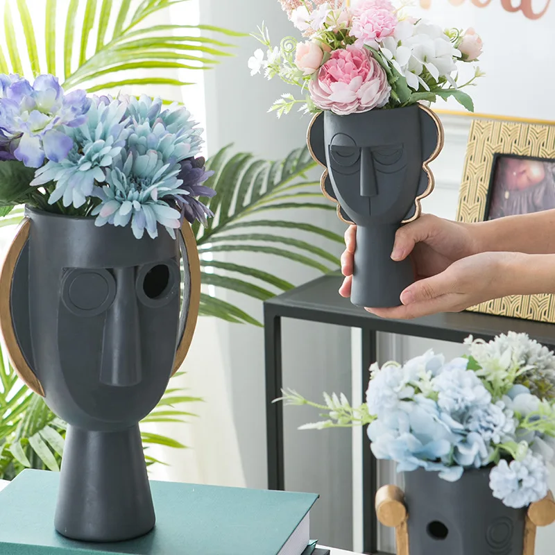 Wholesale 2021 home decor black resin face flower vase