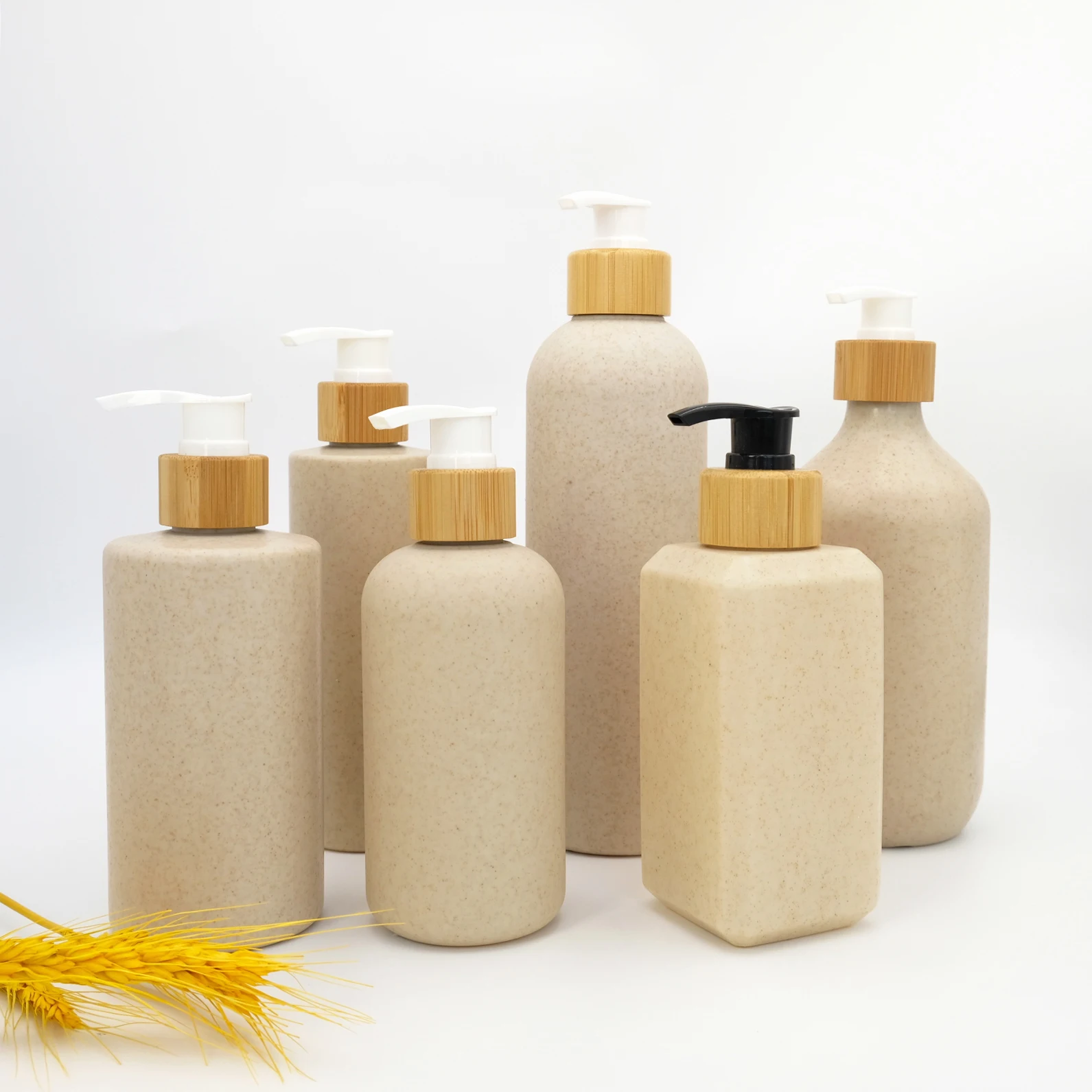 ECO Biodegradable 50ml 100ml 150ml 250ml 300ml 350ml 500ml HDPE Wheat Straw Lotion Empty Bottle with Bamboo Pump