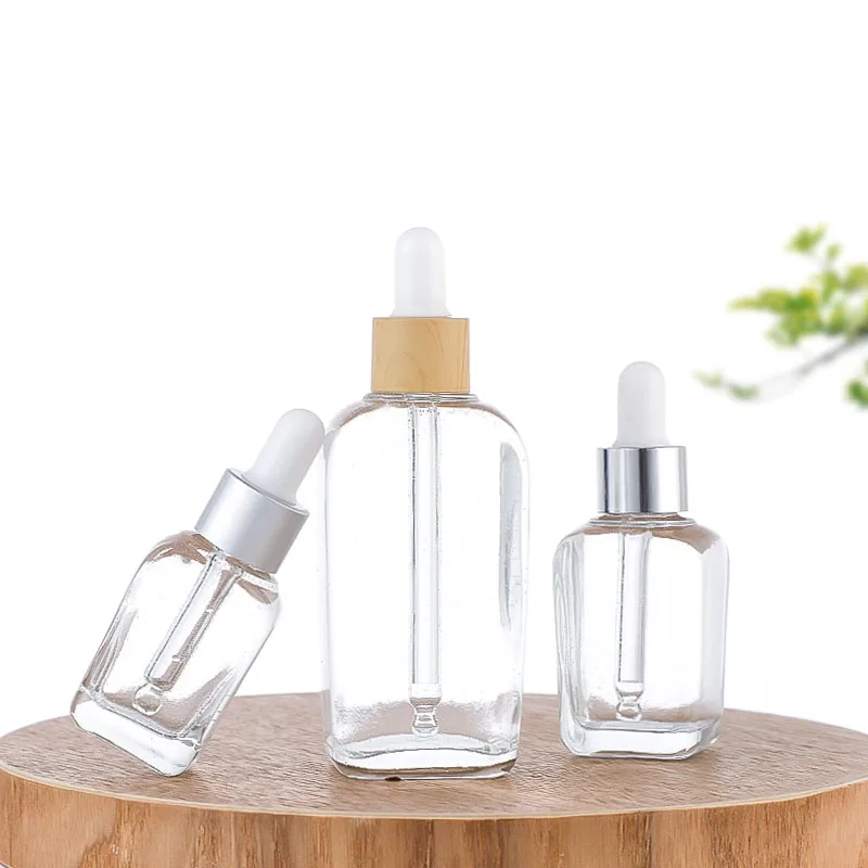 2024 modern label printing 1 ounce 50ml glass thick bottom large dropper bottle with silicone lid