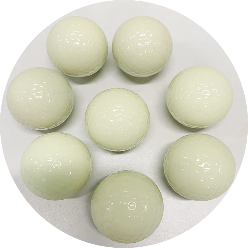 white fluorescent golf ball in golf  balls