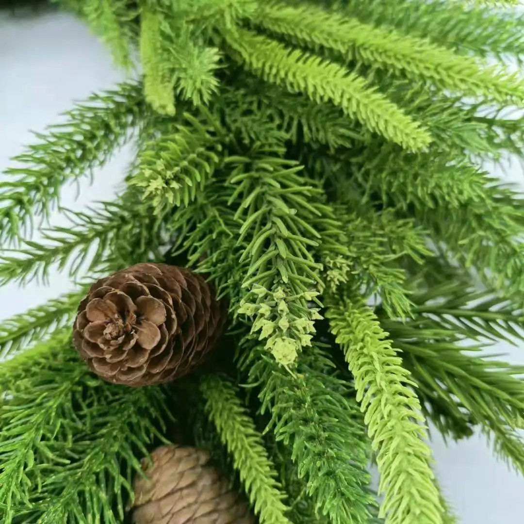 Artificial pine needles and pinecone wreath for Christmas