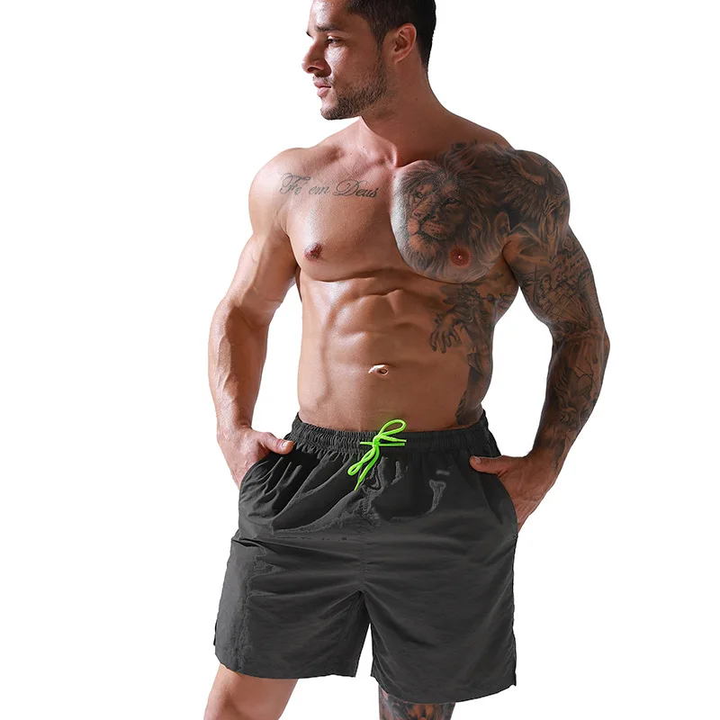 wholesale men pants summer sports shorts loose fit quick dry polyester board shorts male swim trunks beach shorts with pockets