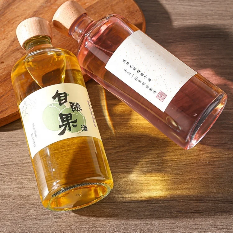 Top-ranking Products 500ml 700ml Transparent Round Glass Liquor Wine Vodka Tequila Bottle With Sealed Cork