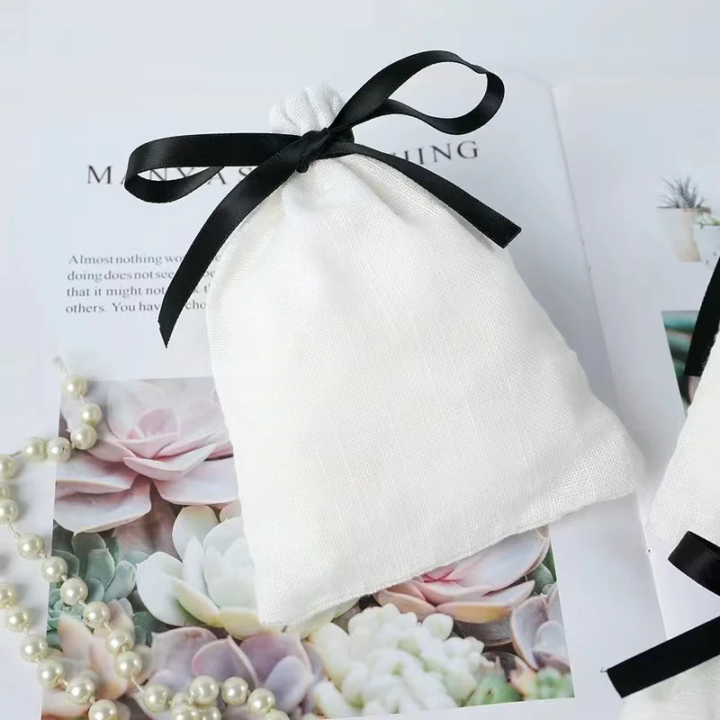Customized cotton bag with log, bow and ribbon storage bag, headphone and watch storage bag