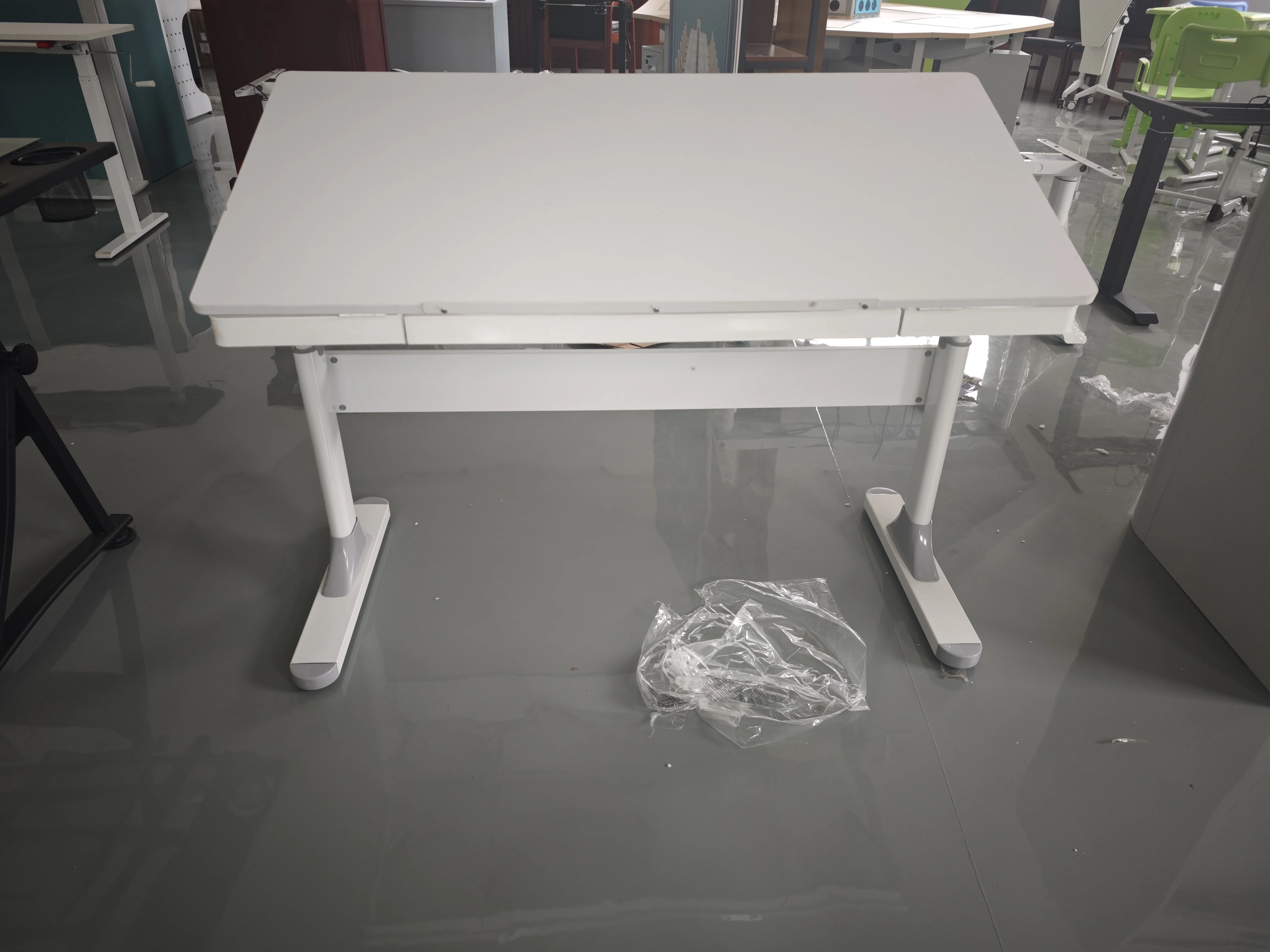 A multifunctional office desk with adjustable height and tilting angle for studying and studying