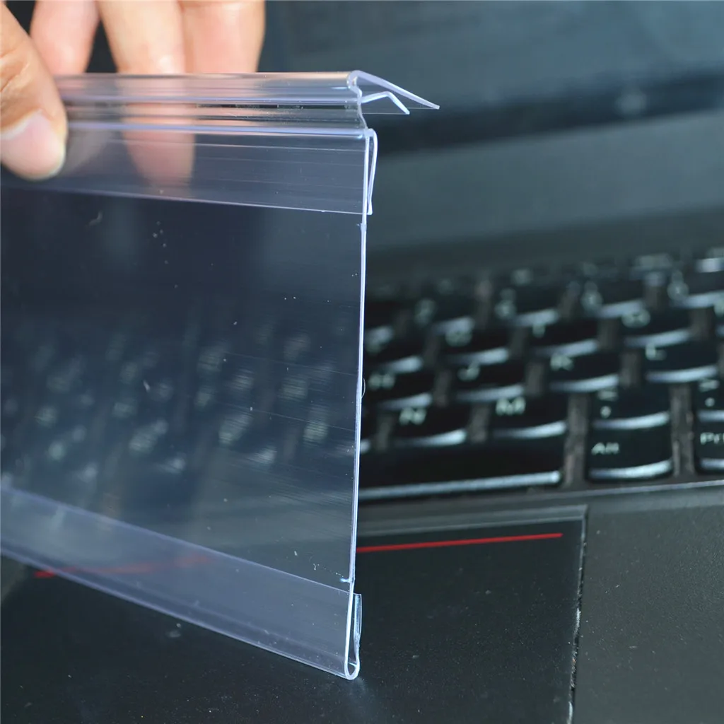 Extruded hinge label holder for supermarket shelves