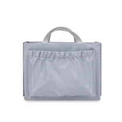 Detachable diaper bag liner with 6 total pockets, including an insulated pocket, keychain and washable changing pad.