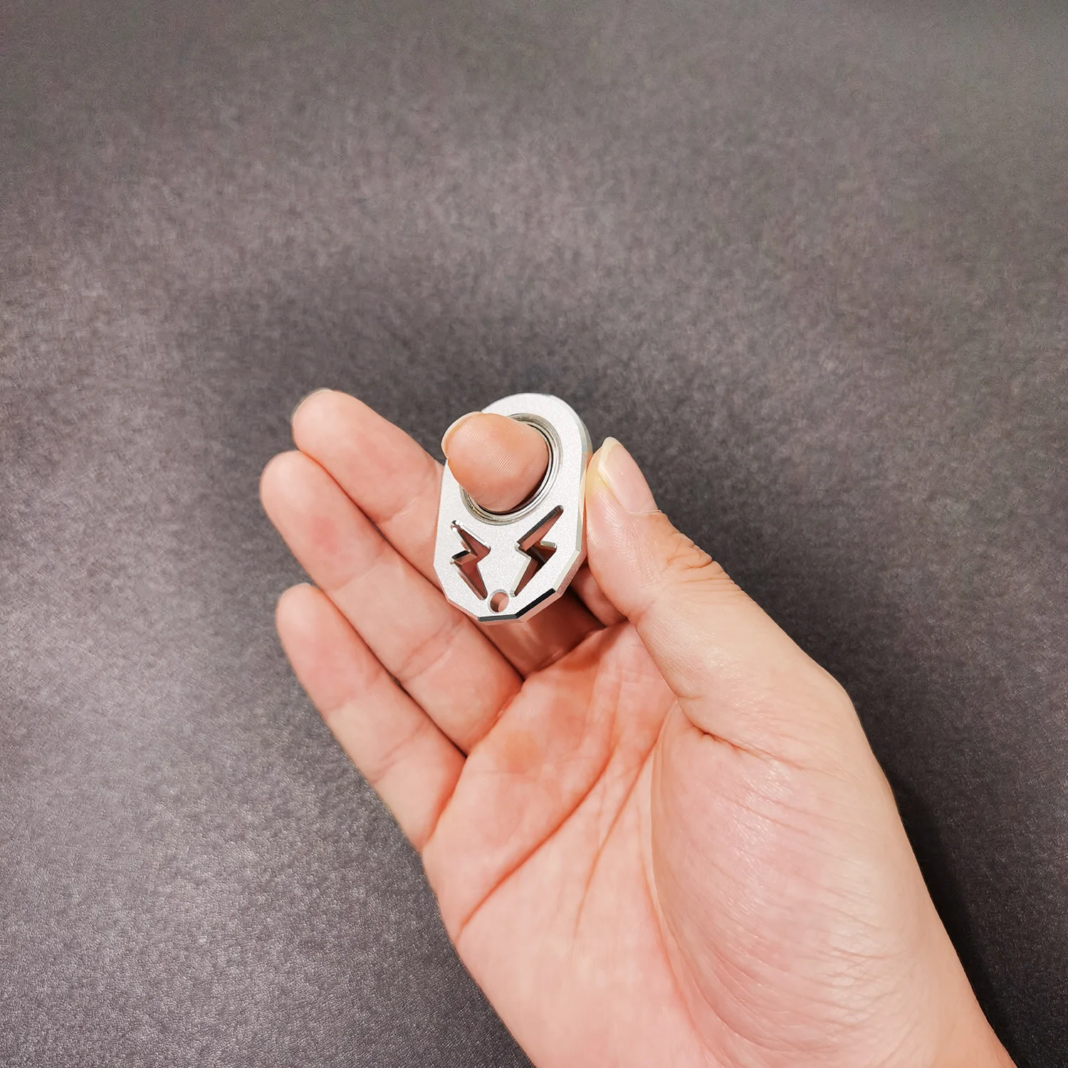 The super fun fidget keychain spinner with lightning logo matches your keys and pendant spin it anywhere anytime