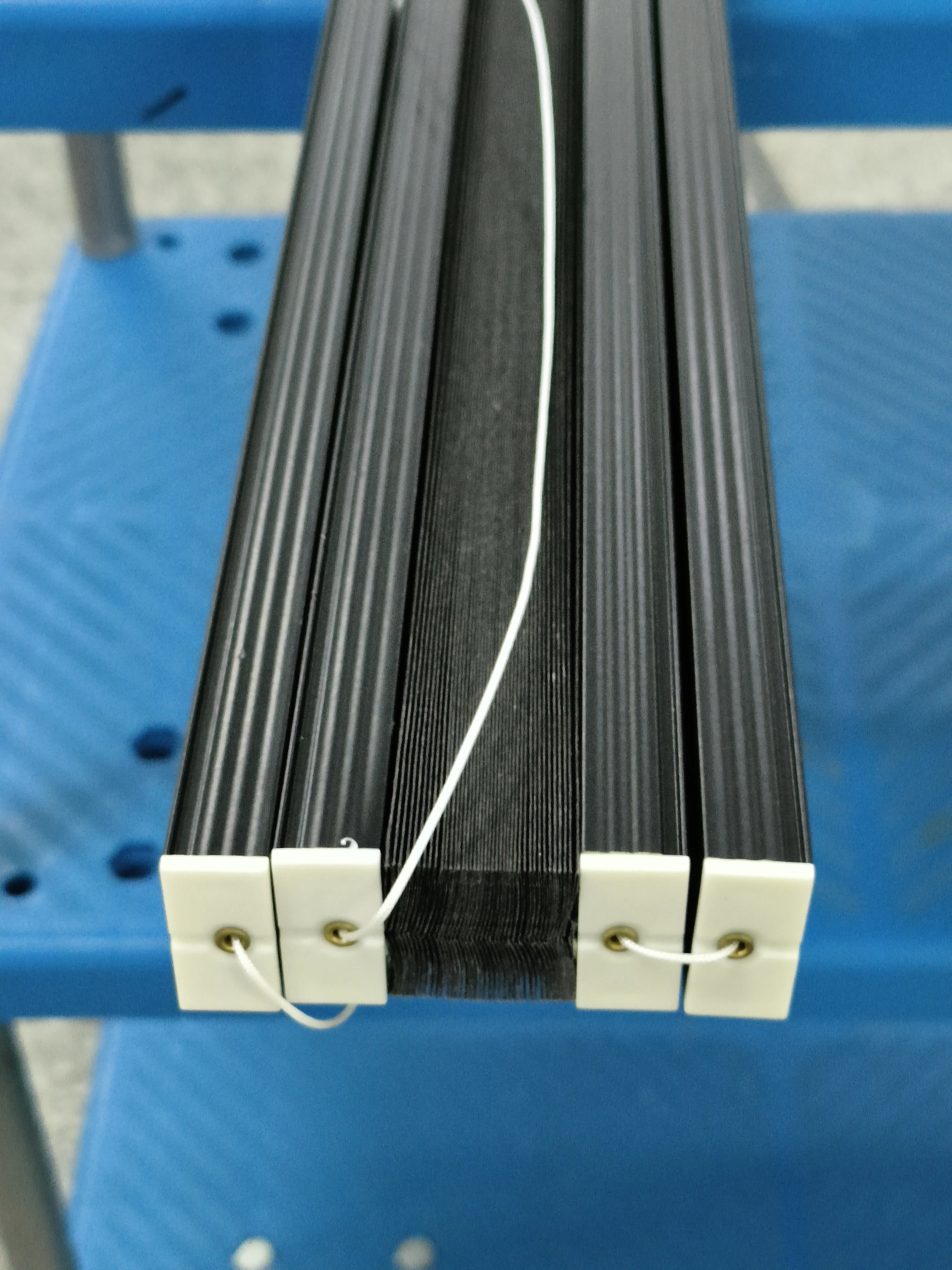 Cordless black color blackout cellular blind