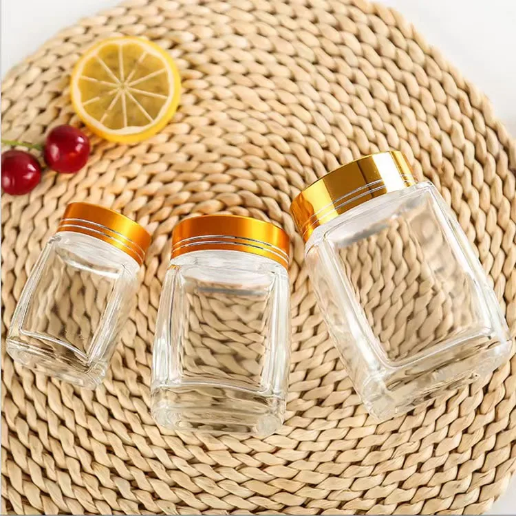 Wholesale square glass honey jar with screw metal lid glass bottle container