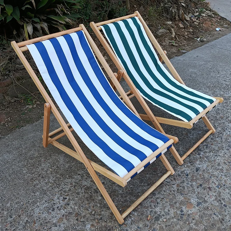 black and white stripe outside lazy rest beach hotel chaise lounge swimming pool wooden sun deck chair