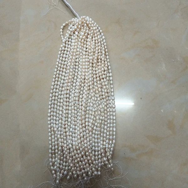 Wholesale Fresh Water Pearl Cheap 7mm Rice Shape Cultured Pearl Necklace Loose Rice Pearl Strand