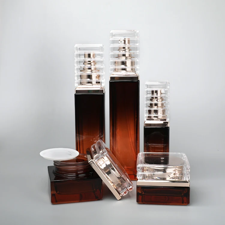 factory wholesale high quality Skincare Packing Set Amber Cosmetic Face Cream Jar Square Glass Body Lotion Bottle with Gold Pump