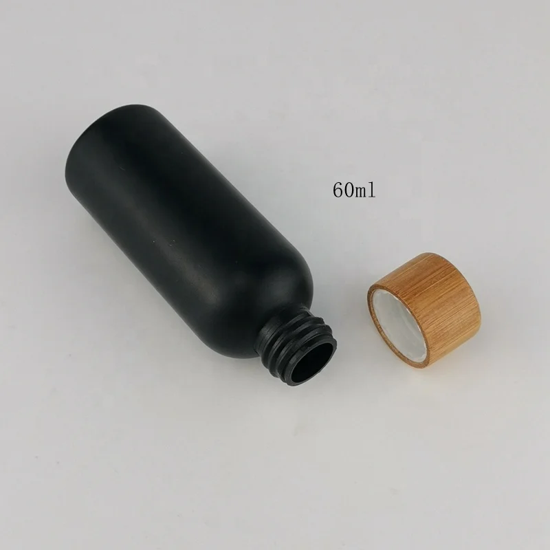60 ml matte black bottles 2 ounce plastic HDPE bottle with bamboo closures for cosmetic packaging