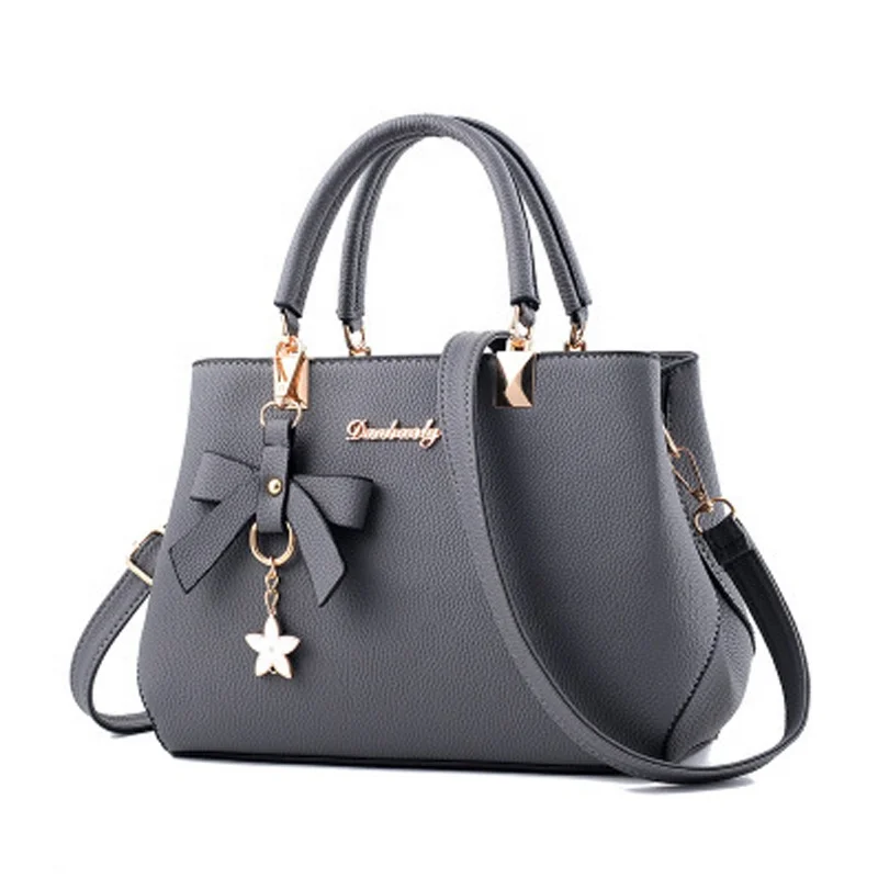 wholesale fashion women PU leather blue shoulder bag with zipper pockets flower tassel