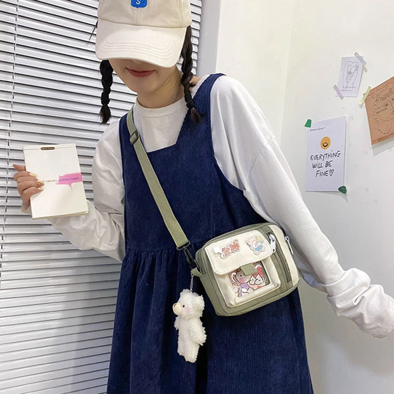 The new 2022 single shoulder slope across soft sister little girl cute nylon canvas bag bag change mobile phone lipstick female