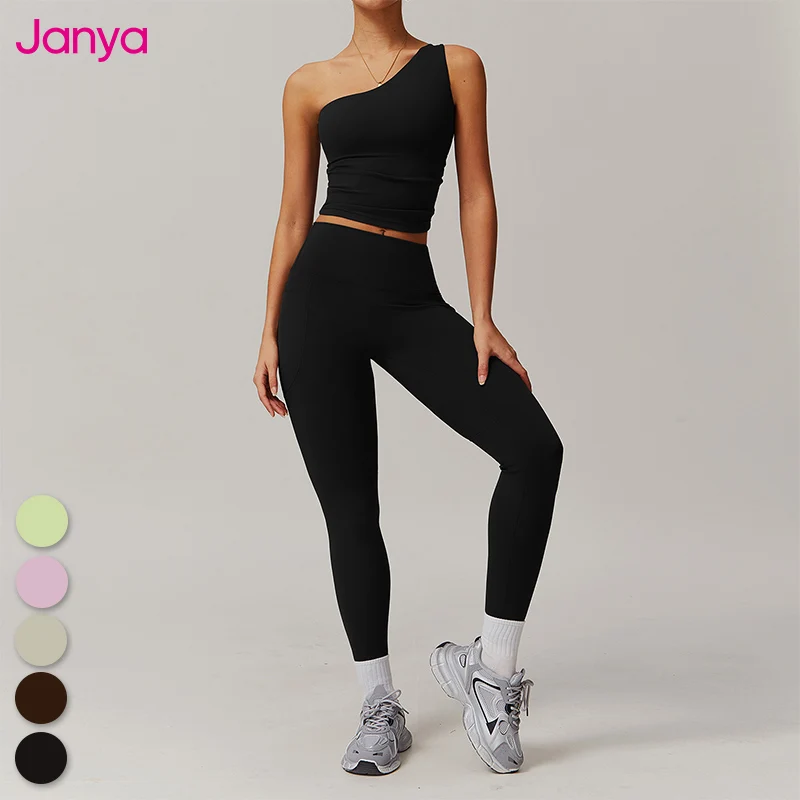Janya Hot Sales Sport Suits Gym Home Yoga Sets One Shoulder Removable Pads Bra And No Front Seam Side Pockets Yoga Leggings Set