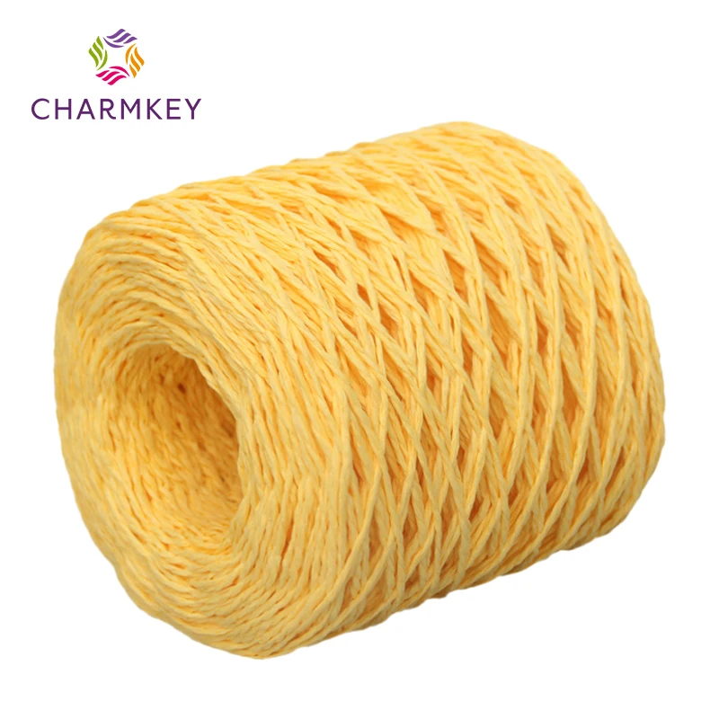 Hot sale customized 110 gram per roll colored flat paper rope 100% Paper Raffia fashion bundle gift box Raffia yarn for crochet