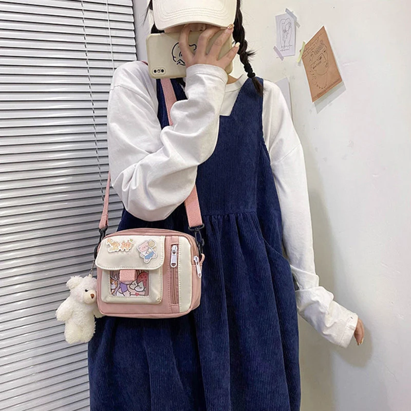 The new 2022 single shoulder slope across soft sister little girl cute nylon canvas bag bag change mobile phone lipstick female