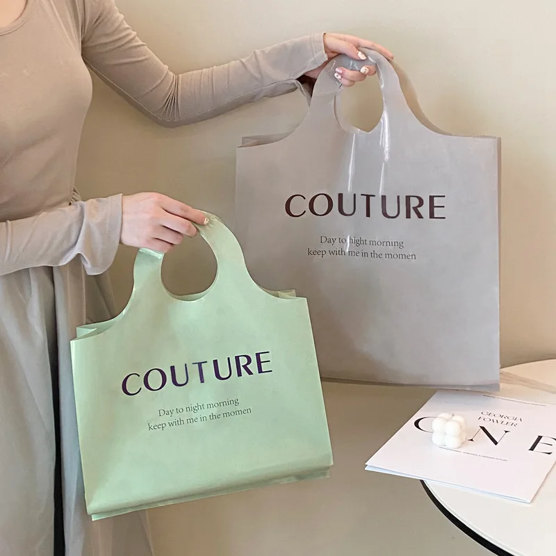 Explosive clothing store thickened plastic portable shopping bags clothes with gift packaging bag spot wholesale