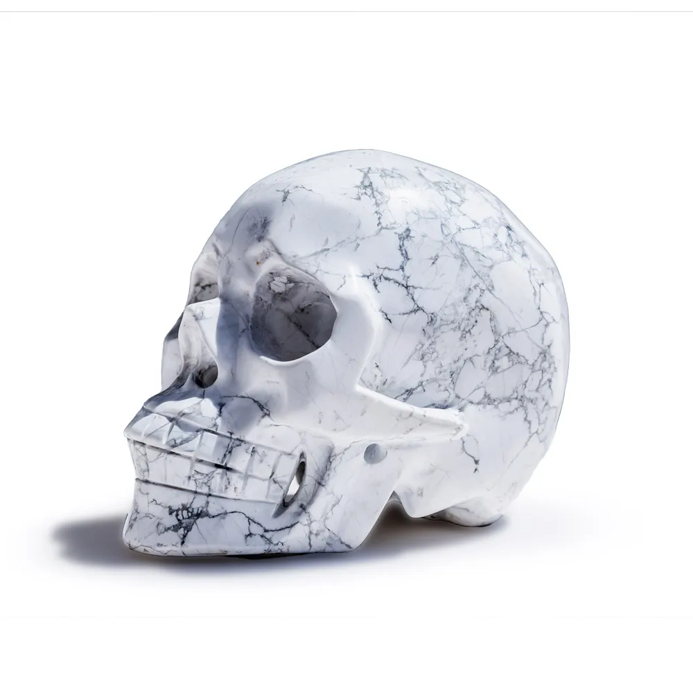Wholesale Natural Polished Hand Carved Howlite Crystal Hollow Skulls Folk Crafts Healing Stone For Home Decoration