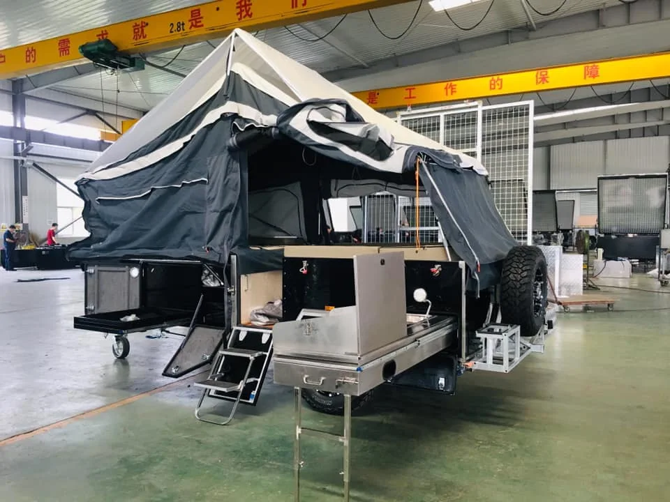 Camper trailer with stainless steel kitchen and folding tap