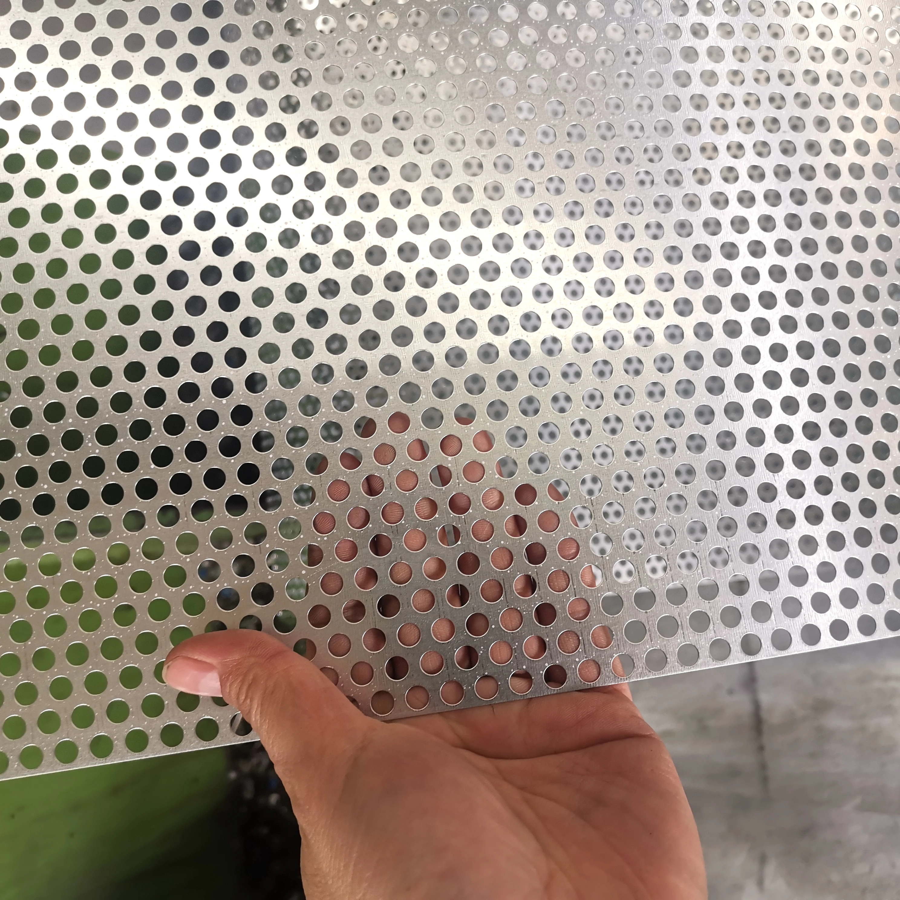 Perforated mesh for filter supporting mesh