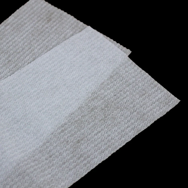 Perforated and embossed non woven fabric for top sheet of baby diapers or sanitary napkins