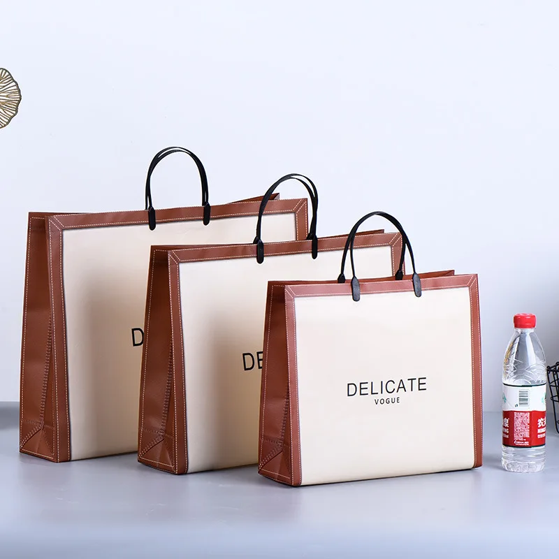 Hot Selling High Quality Customized Logo Non-Woven Portable Shopping Bag White with Striped Pattern for Clothing Packaging