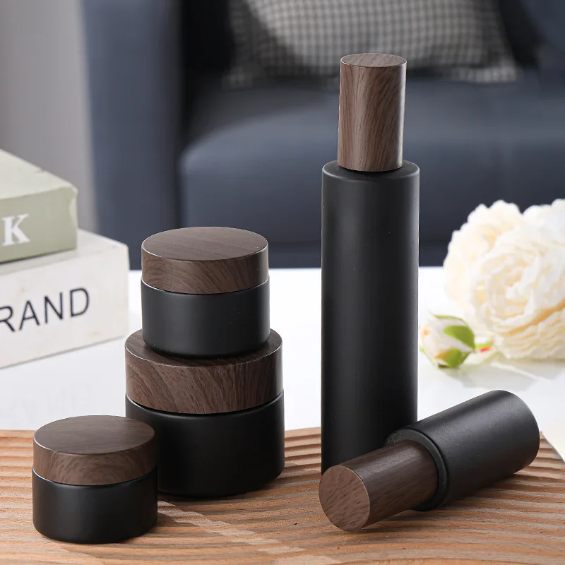 Wholesale 20g 30g 50g 80g 100g Cream Matte Black Glass Jar with New Wood Grain Cover Facial Cream Bottle