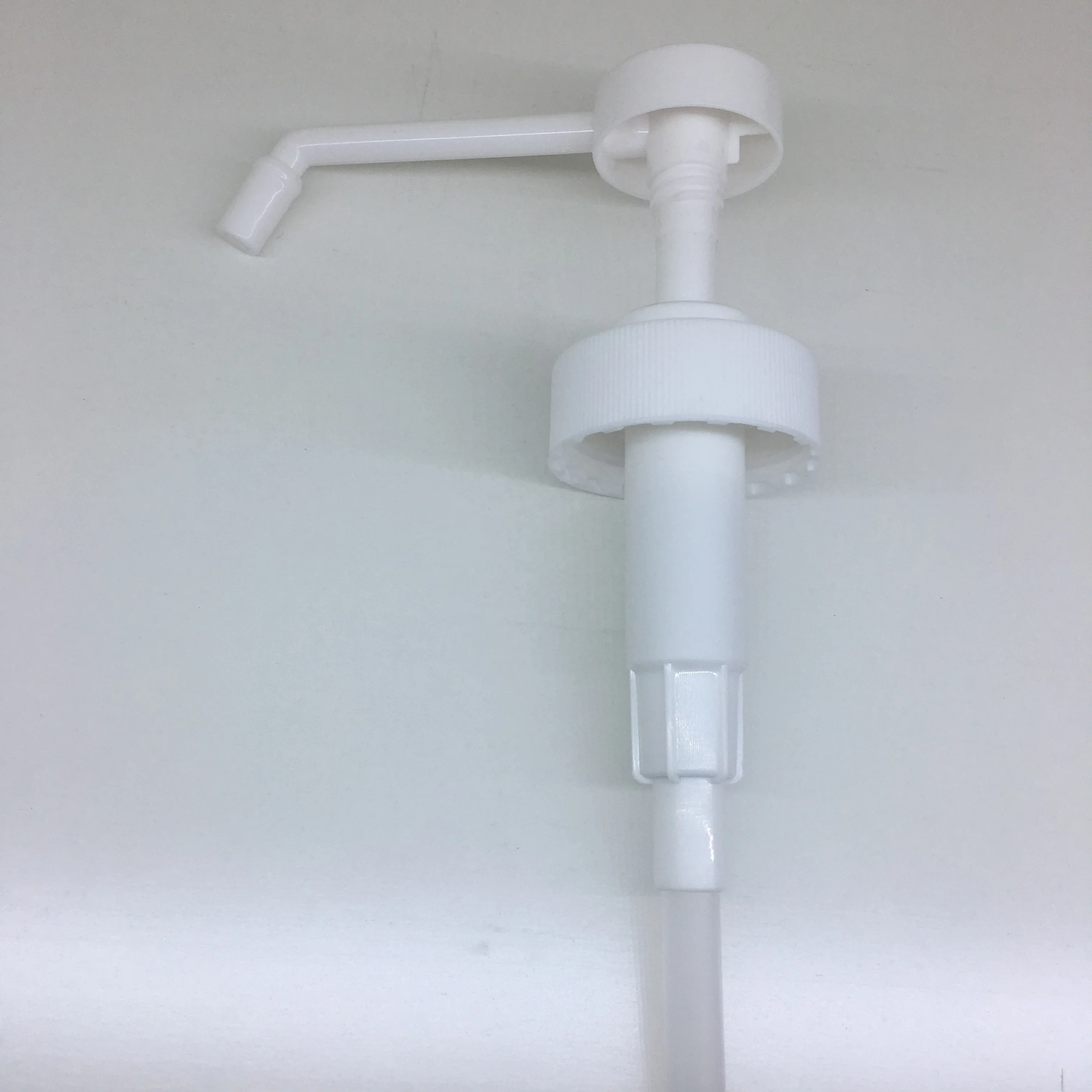 White PP 38-400 sanitizer sprayer dispensing pump with 11 inch dip tube for 1 gallon bottle