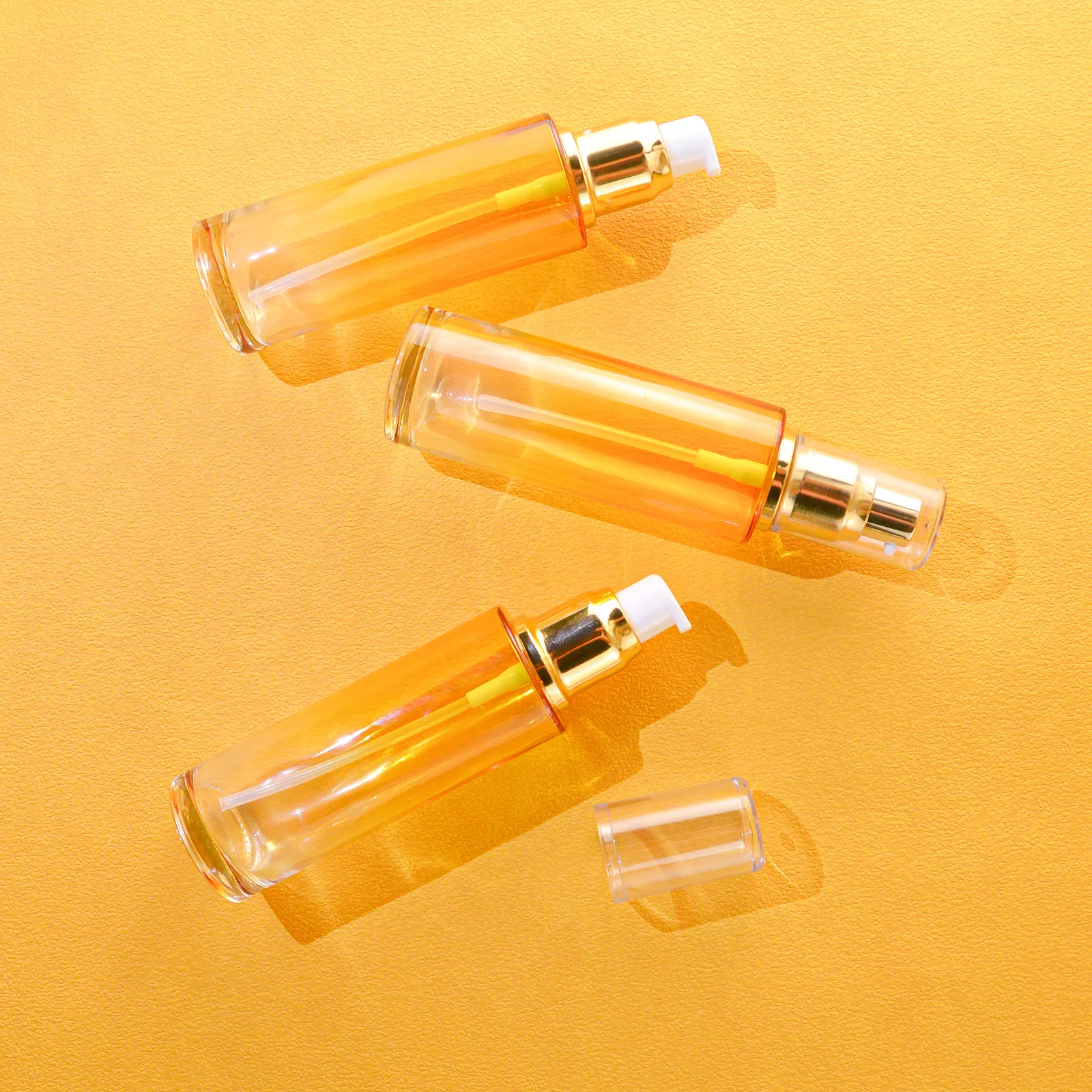 Unique Luxury Cosmetic Clear Empty Glass Hair Oil Serum Lotion Pump Bottle With Gold Plastic Pump Head