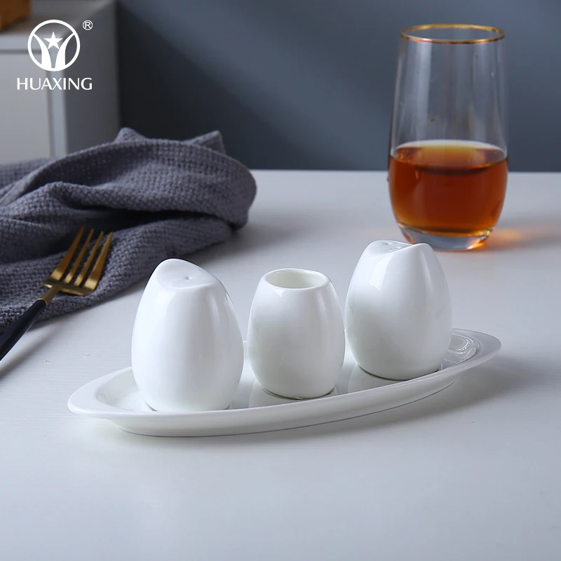 White Custom Egg Shape Bone China Custom Ceramic Spice Jar Salt and Pepper Shakers with Dish