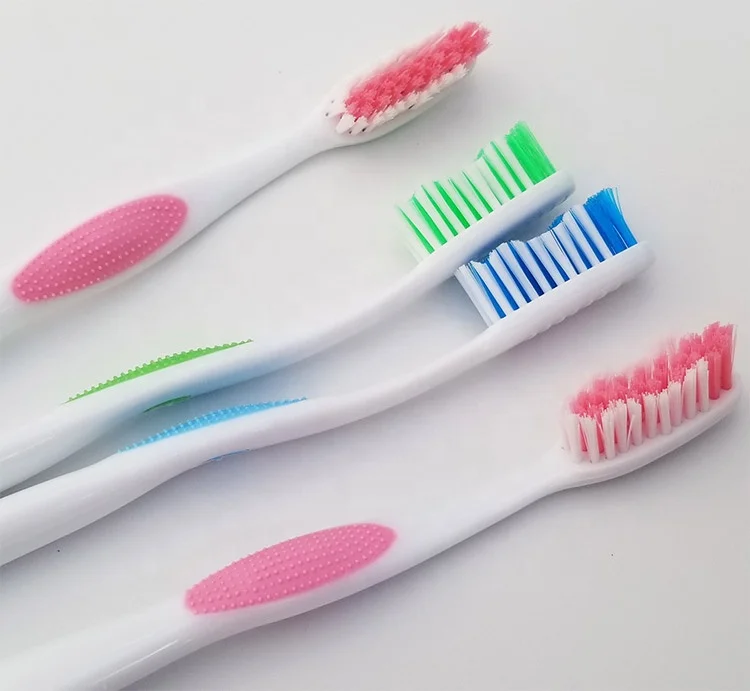 Hard rubber grip adults toothbrush with medium or soft, hard nylon bristle