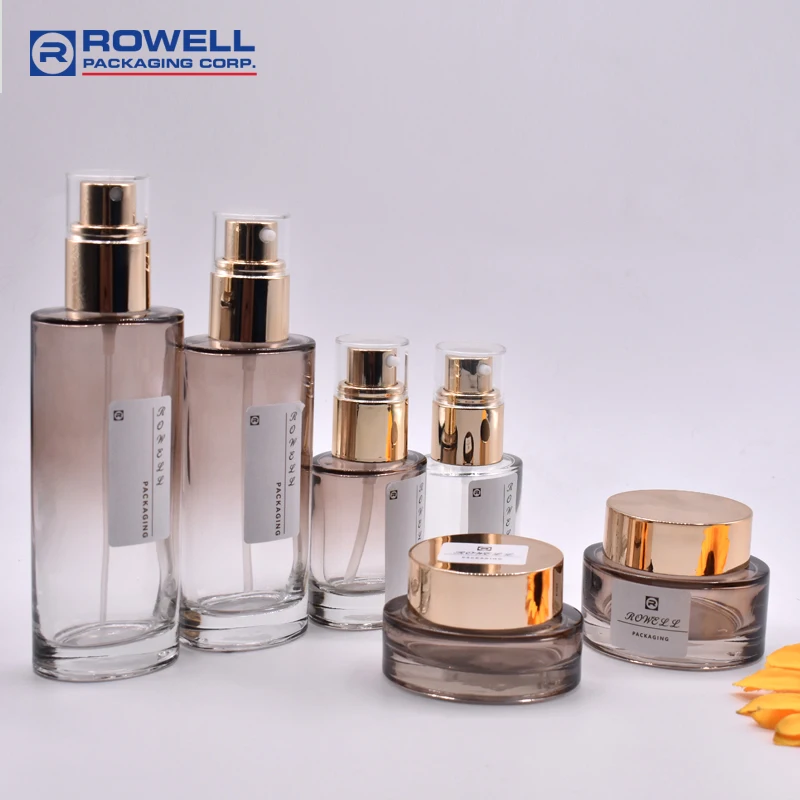 2022 Hot Sales 100ml Lotion Pump Glass Bottle with ALU Gold Press Pump Packaging