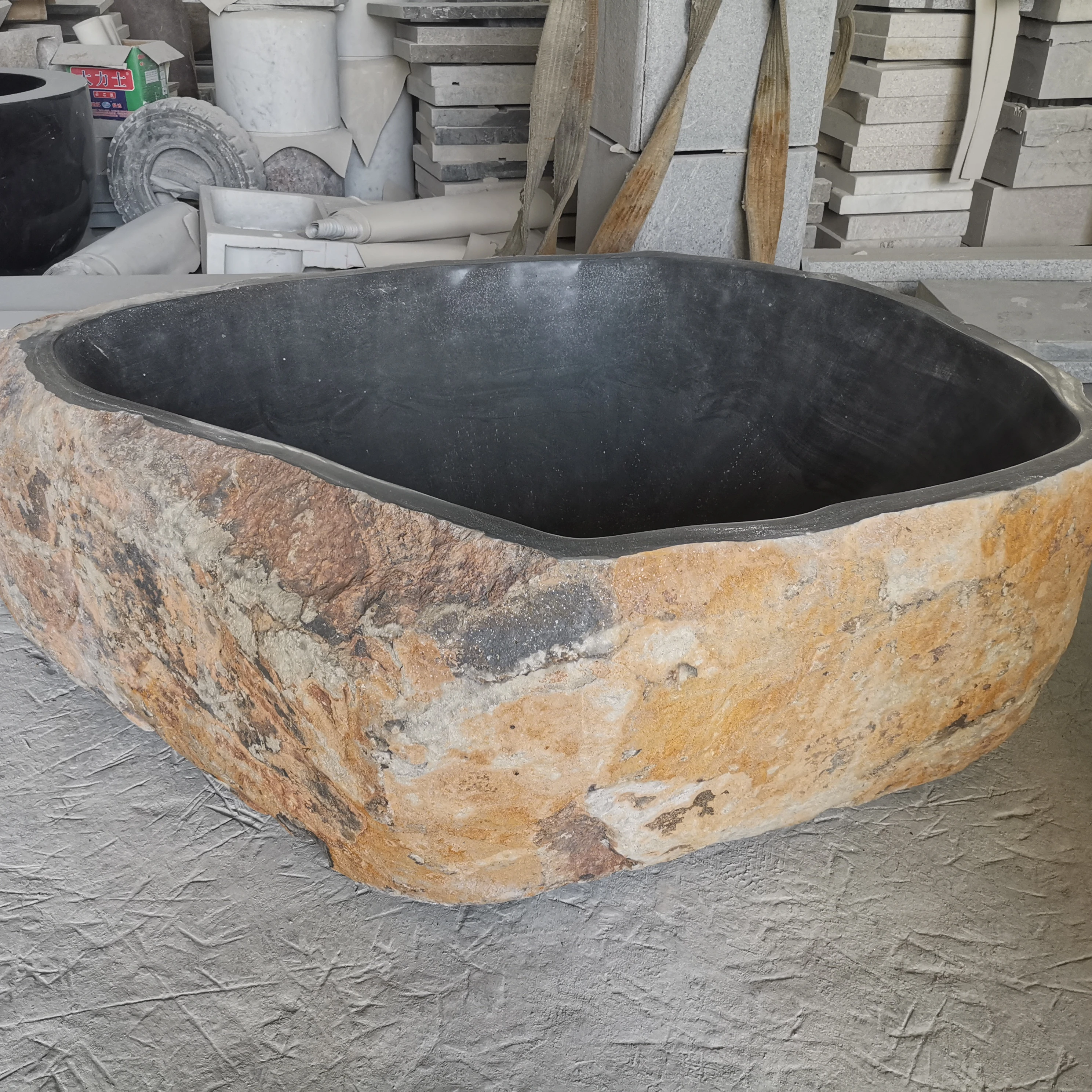 Free standing natural river stone bathtub