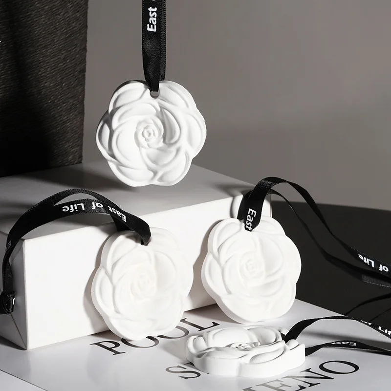 Wholesale camellia car aromatherapy hanging piece home wardrobe aromatherapy wax piece gypsum scented piece air freshener