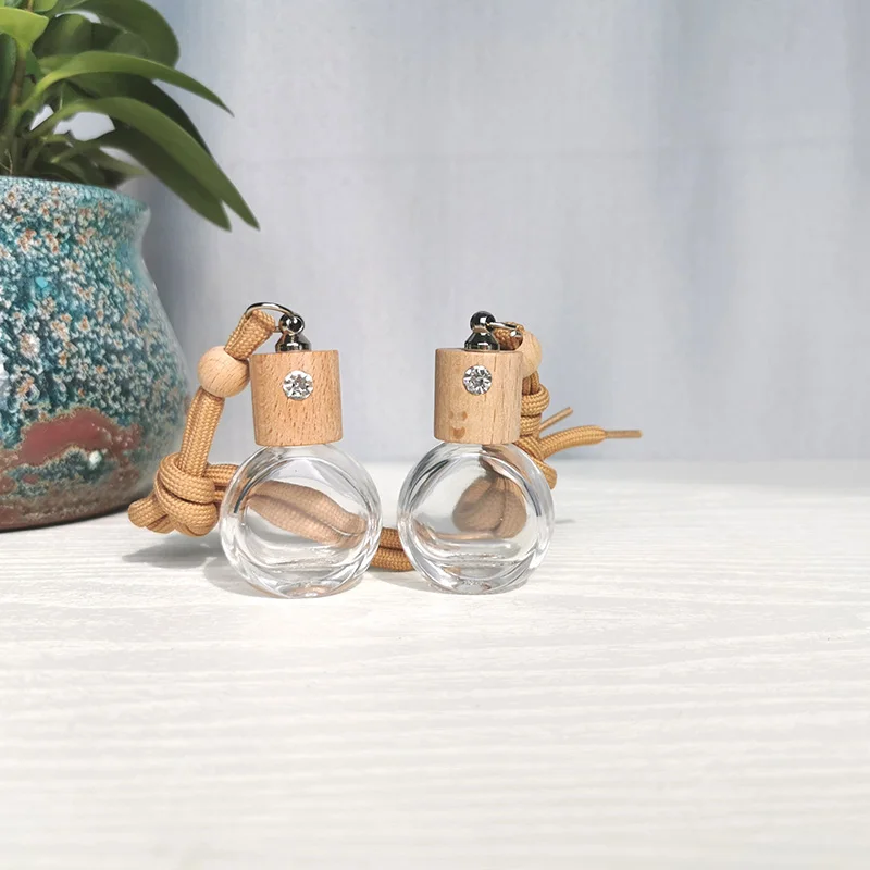 Avertan wholesale 8ml Round shape  High Car Diffuser Perfume Glass Bottle With Hanging Ropes