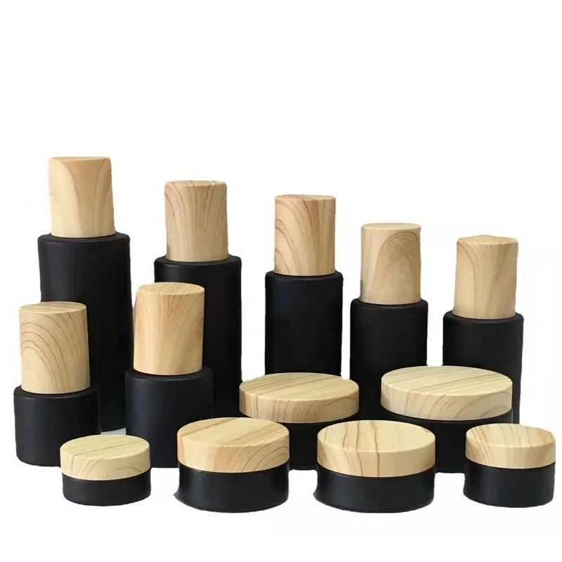 Empty glass cosmetic packaging sets black cream jar with bamboo pattern lid glass bottle for toner lotion in china