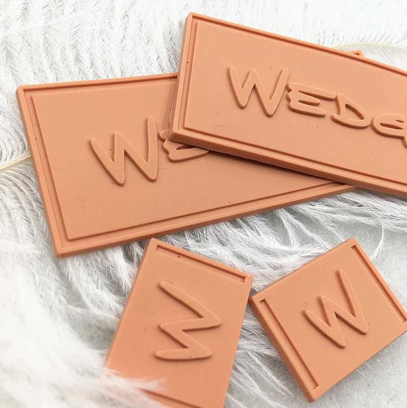 Textured 2D/3D Embossed Garment Rubber Patches High Quality Custom Private Logo Sew On PVC Rubber Labels For Clothing