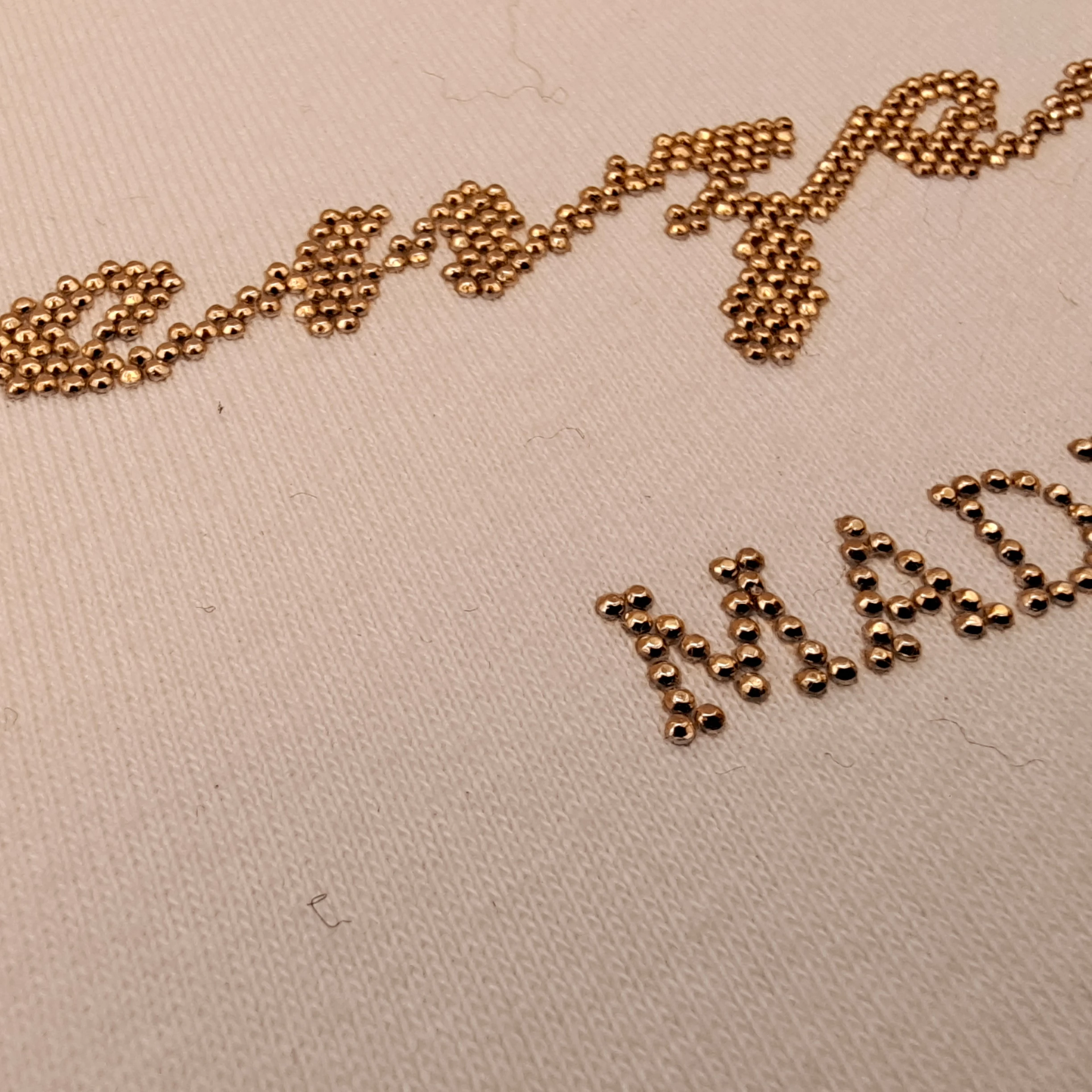 
Customized rhinestone transfer T-shirt with seamless arrangement of English colored crown letters with high fastness 