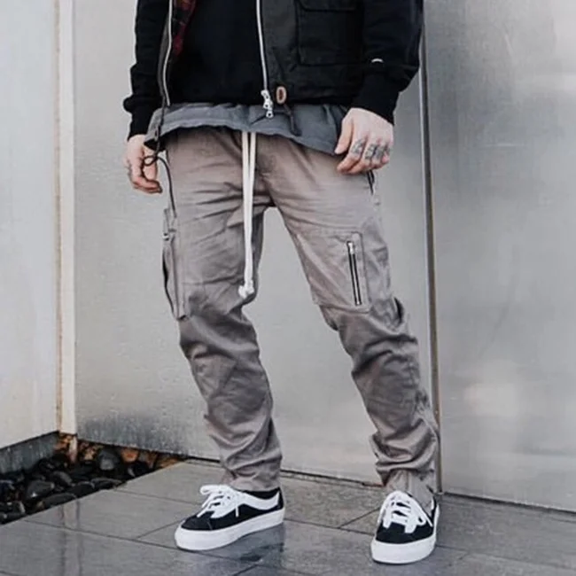 
Low moq street multi zipper pockets pencil pants solid color elastic drawstring jogger pants popular casual cargo pants stock 