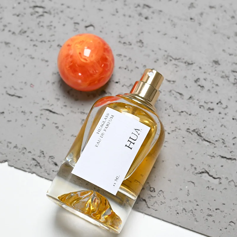 Luxury 50ml round glass perfume bottle with marble covered mountain bottom unique perfume bottle