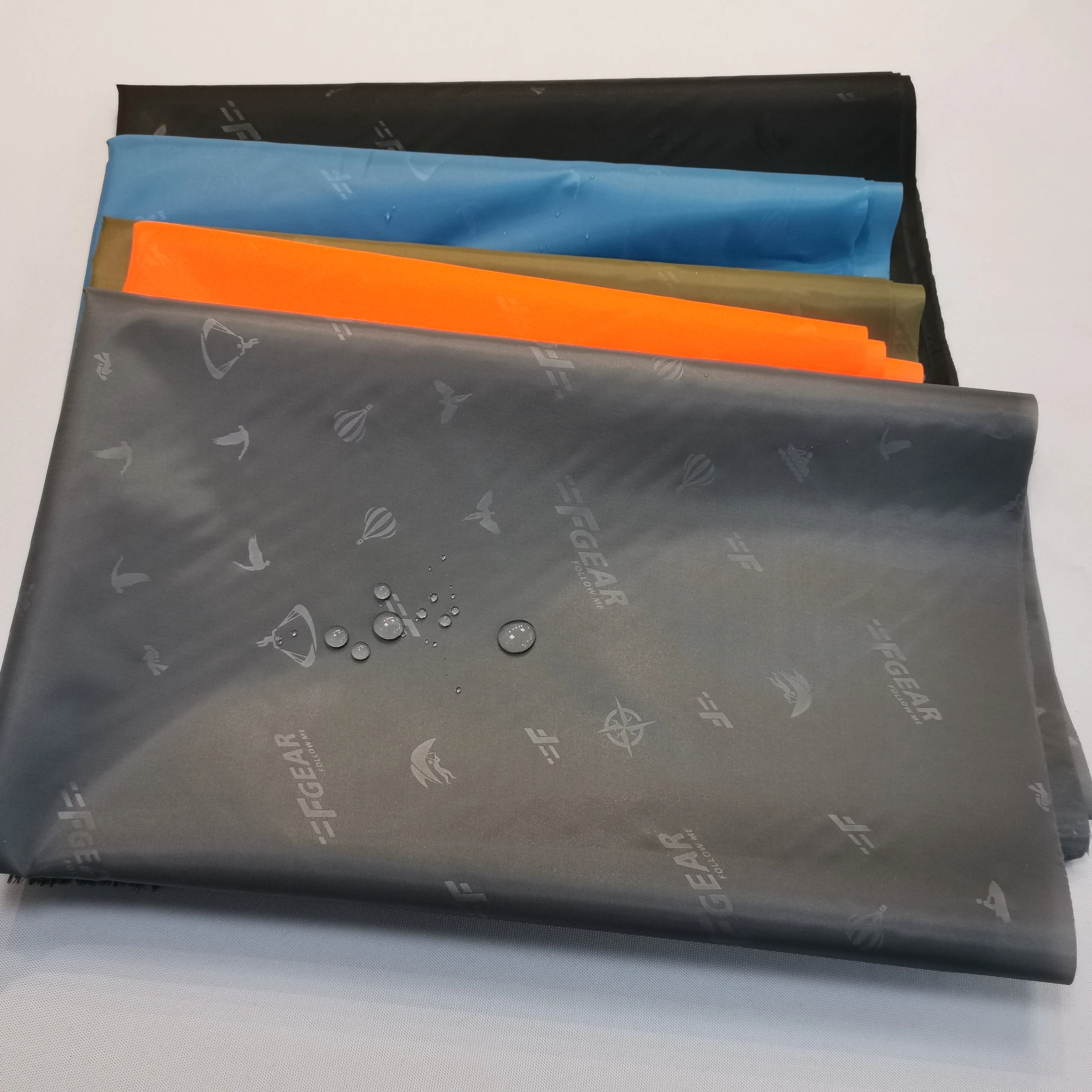 High quality woven jersey polyester jacquard with twill taffeta embossed red-crowned crane logo jacquard lining