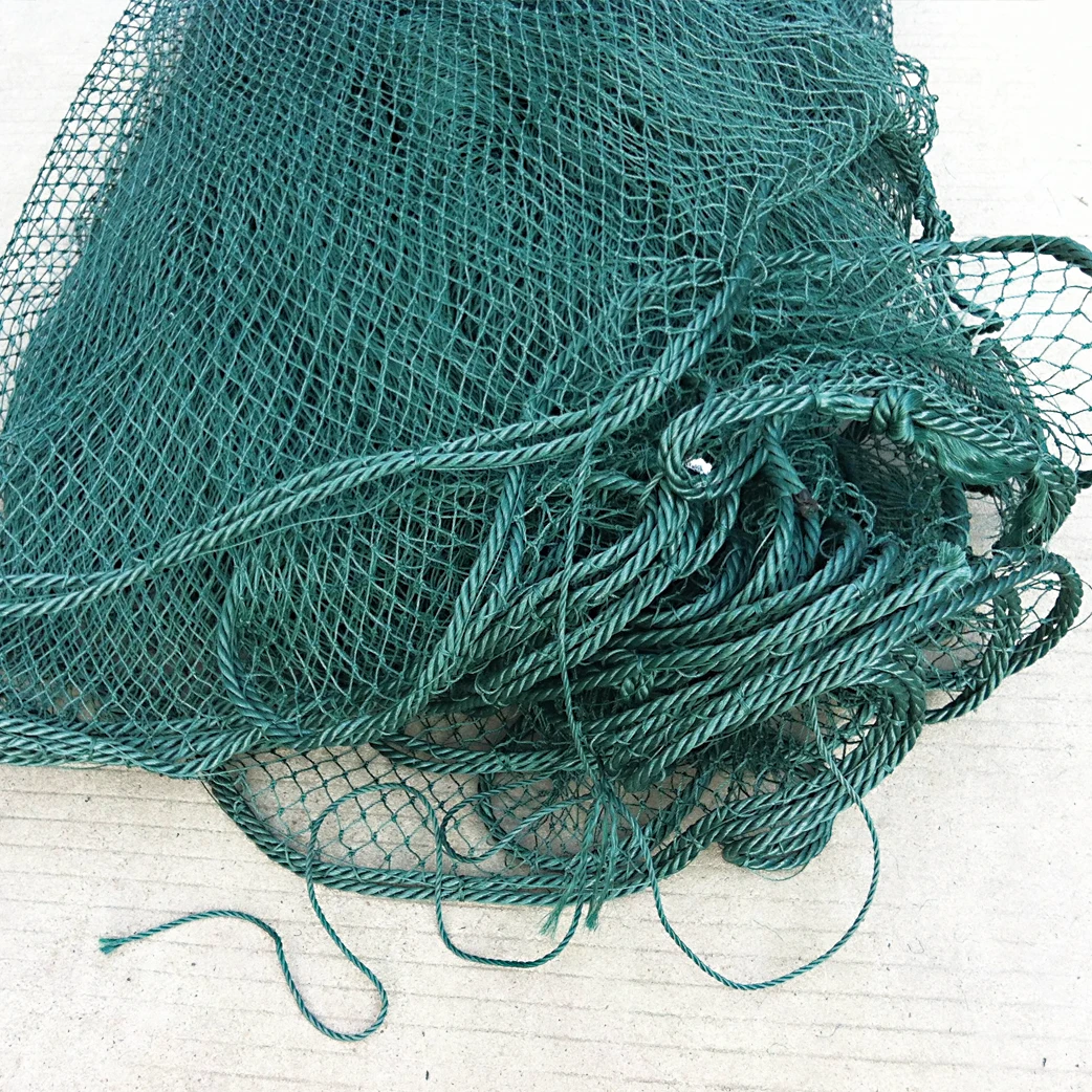 Small trawl nets or drag net for river and nearby sea small fish fishing and catching on boat