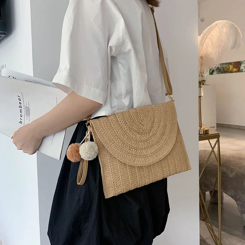 
Raffia clutch hand evening bag pu leather long strip sling woven beach rattan straw bag with pom pom 