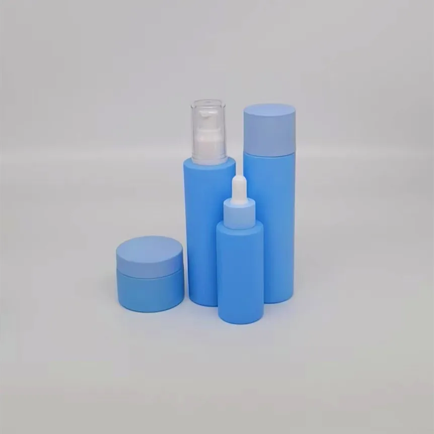 Low MOQ empty 30ml 1oz glass blue frosted cylinder glass essential oil dripping bottle rubber stopper