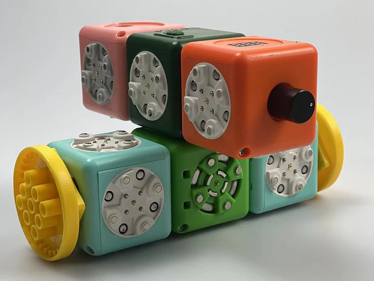 All That Wheels Moving and Turning Programmable Interactive Magnet Building Blocks