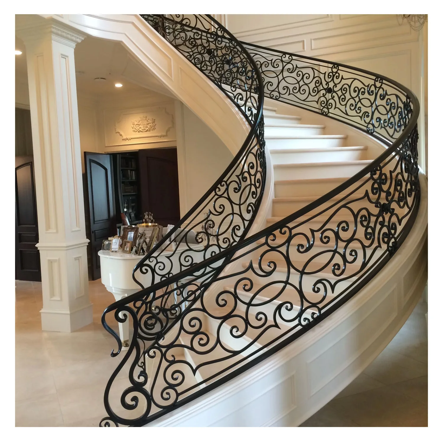 Classic and luxury design of villa or resident interior wooden curved staircase with wrought iron balustrade Australia code